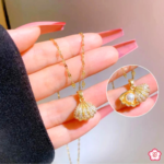 Golden Pearl in a Shell Pendant Necklace